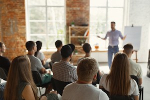 Male speaker giving a summit workshop presentation